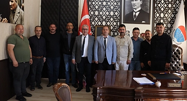 Bayramiç Belediyesi şoförleri ve zabıta amiri, Başkan Hasan Cem Atılgan'ı ziyaret etti