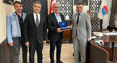 UEDAŞ yetkililerinden Bayramiç Belediye Başkanı Hasan Cem Atılgan'a tebrik ziyareti