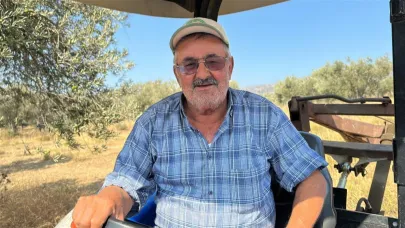 Zeytinliğinin etrafını süren İrfan Çimen’in arazisi yangından etkilenmedi