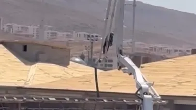 Beton pompasını asansör gibi kullandı, metrelerce yüksekliğe çıktı